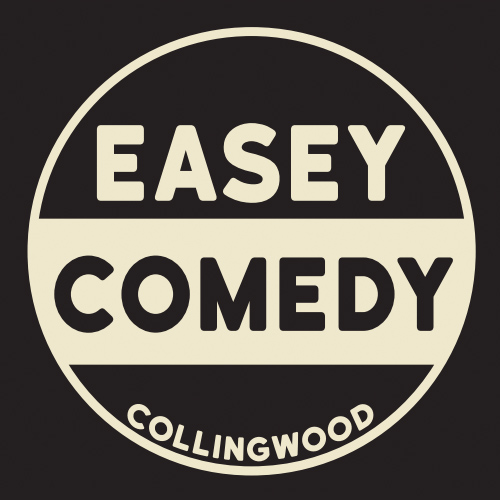 Image is of a logo. On a black background is a light lemon yellow circle with a light lemon yellow, thick band running from left to right of the inside of the circle, just slightly below the middle. The word EASEY is in light lemon yellow above the band, in big font. In the band is the word COMEDY, in big font. Running along the bottom of the inside of the circle is the word COLLINGWOOD, in smaller font.