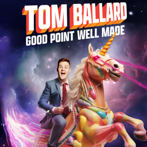 AI image of Tom Ballard. Tom is wearing a light blue suit, pink shirt and maroon tie. Tom has short blonde hair. He is sitting on top of a rainbow unicorn that has laser beams pointing out of its eyes. Tom’s mouth is wide, and he has an excited expression on his face. Background is of pink, blue and purple clouds.