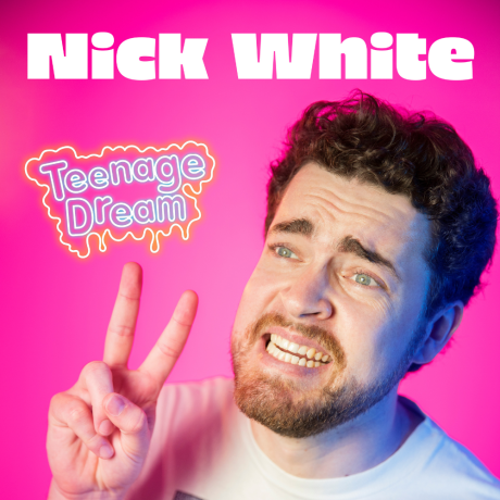 Image is of Nick White. Nick has short brown hair and a short beard. He is wearing a white t-shirt and standing in front of a pink background. Nick is making a peace sign with his hands and looking off into the distance.