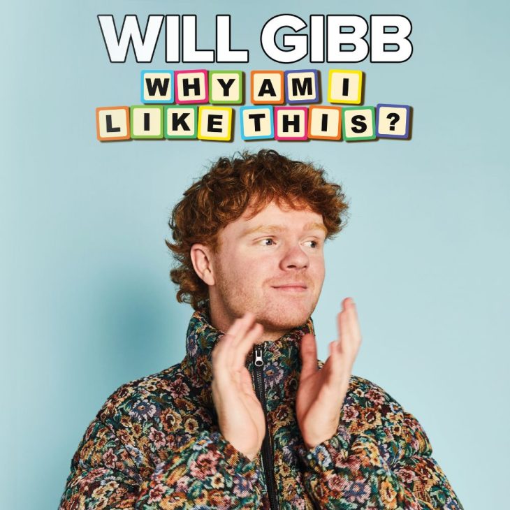 Will Gibb claps his hand. He's wearing a colourful puffer and stands in front of a blue background. Blocky text spells out 'Why Am I Like This?'