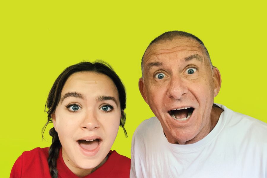 Image is of Pete (left) and Frankie (right) Rowsthorn looking into the camera and smiling. Pete is wearing a light blue button up shirt and Frankie is wearing a dark long sleeve shirt.