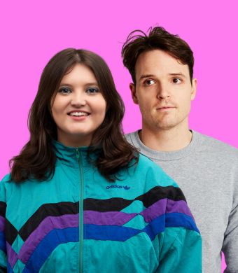 Comedians Sez and Tom Walker in front of a pink background